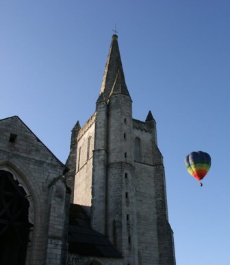 Hot air balloon passing the Abbay de Bois Aubrey Gites.